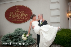 A happy couple in front of The Berkeley Plaza on their wedding day- courtesy of JF Photography
