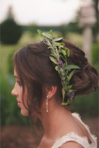 Classy lavender flowers included into a pretty updo hairstyle for your special day! Bonus: you'll get to smell lavender all day long... by Bit of Ivory Photography