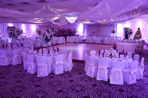 Lavender uplighting at the Berkeley Plaza. A gorgeous background color for your wedding courtesy of our signature uplighting.